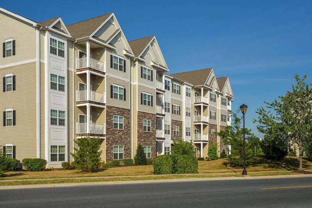an apartment building on the side of a street
