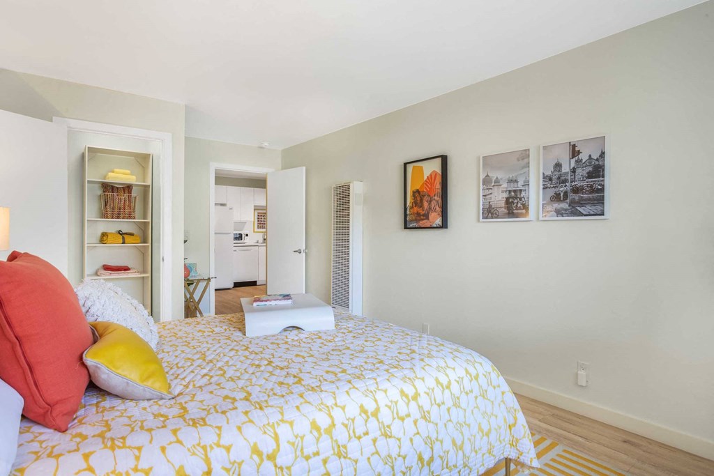 a bedroom with a bed and a closet