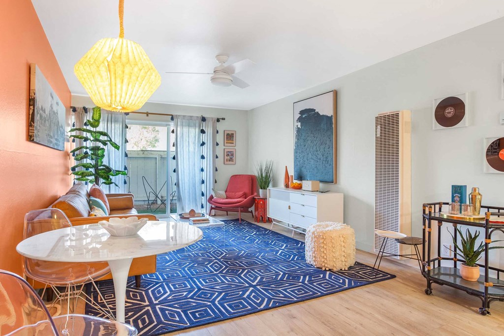 a living room with a couch and a table and a rug