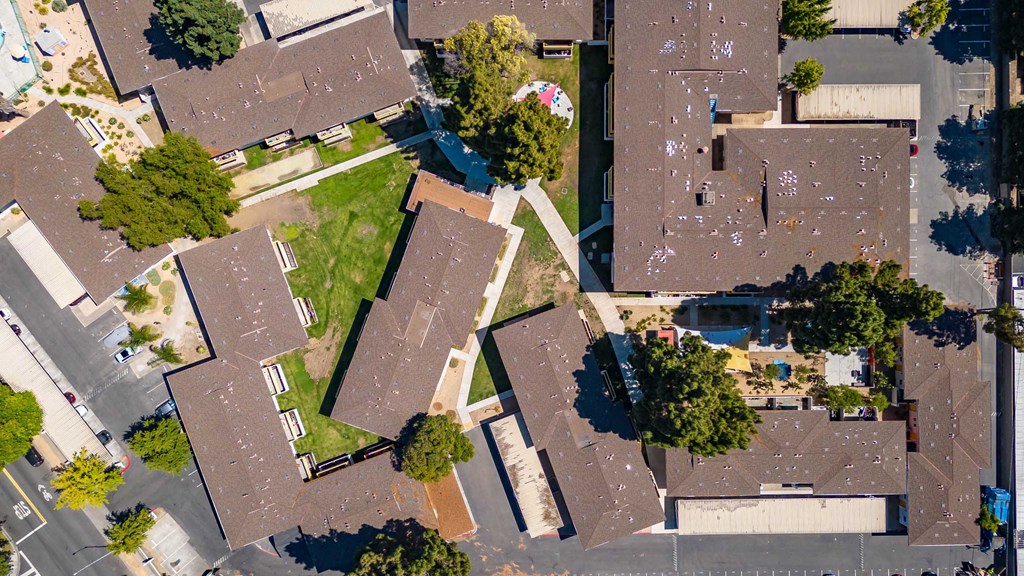 an aerial view of a neighborhood with houses and trees