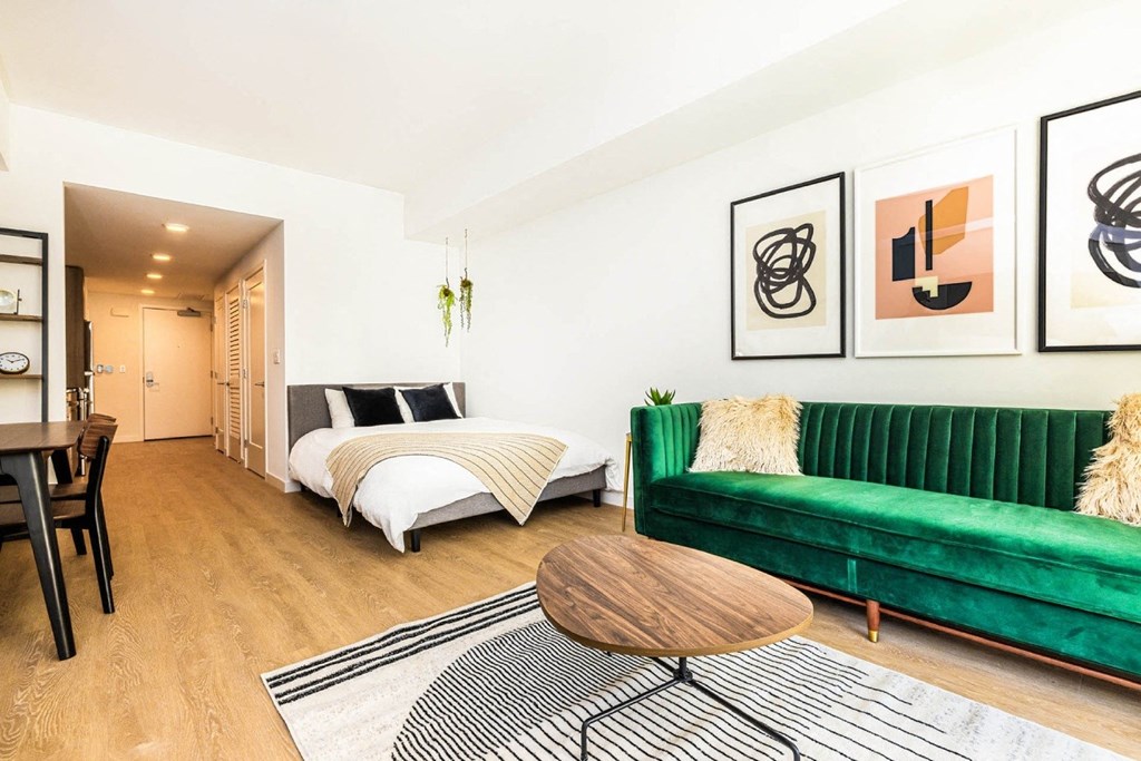 a living room with a couch and a bed