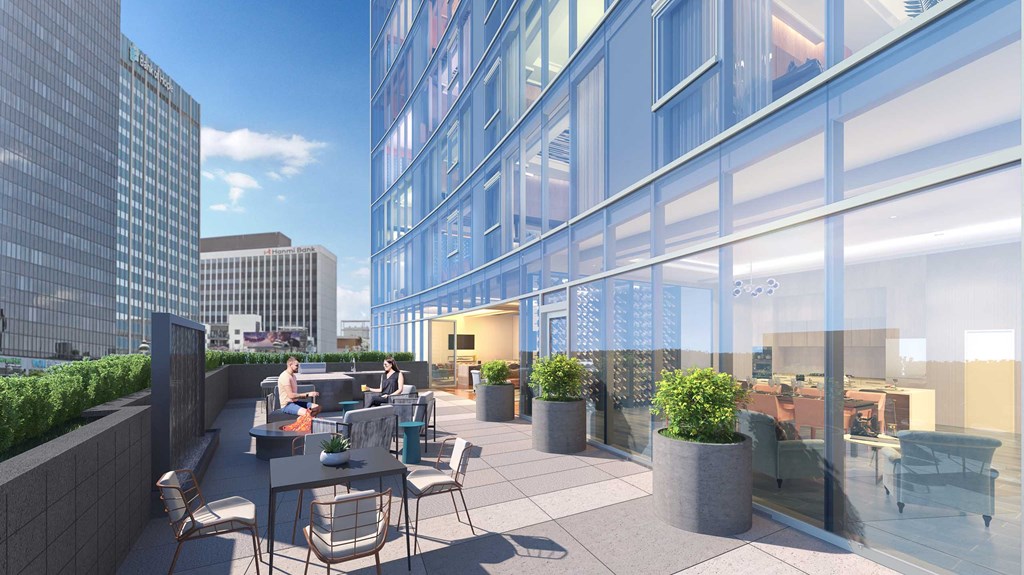 a rendering of a terrace with tables and chairs on a building