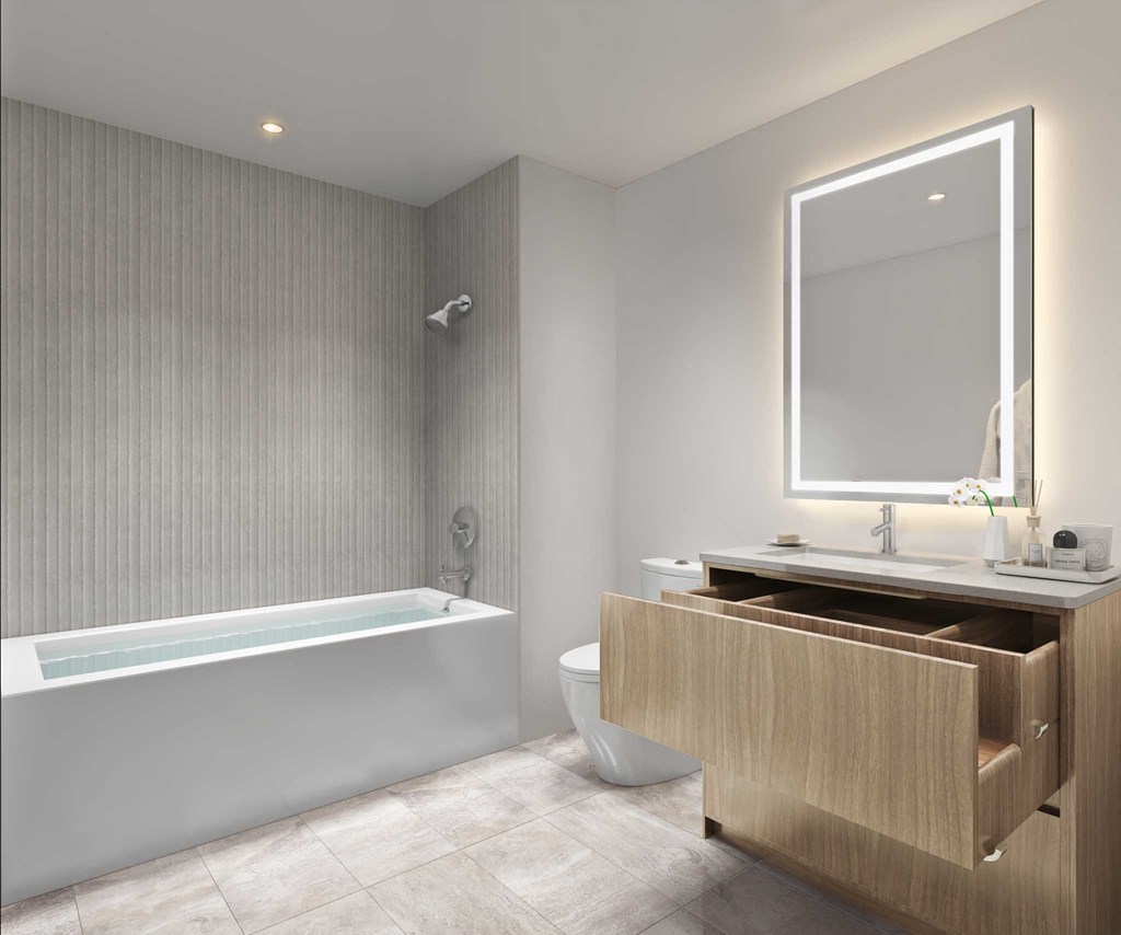 a bathroom with a toilet and a sink and a bath tub