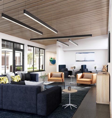 a living room with couches and chairs and a table