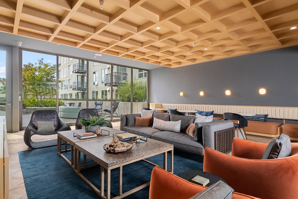 a living room with couches and chairs and a coffee table