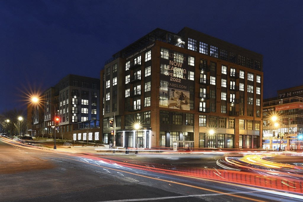 a night view of a building at night with street lights
