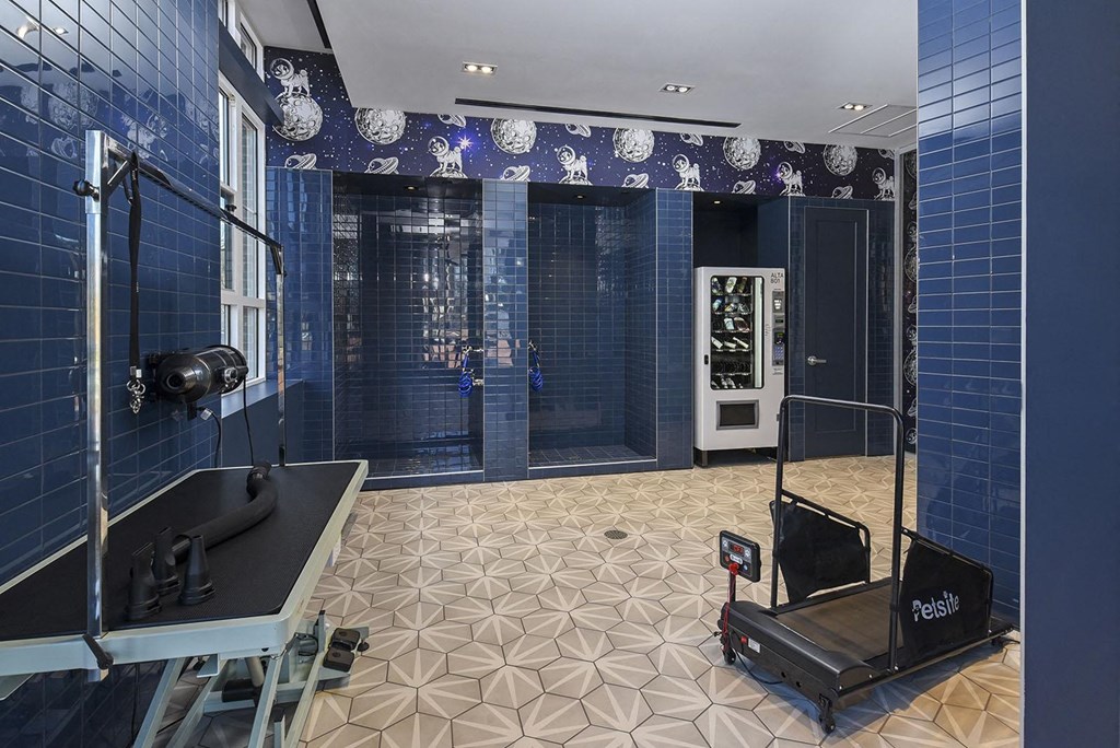 a recording studio with blue tiles and a piano