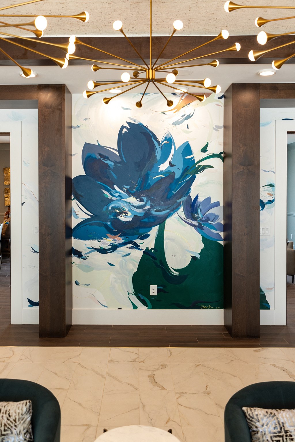a large mural of a blue flower on a wall in a lobby
