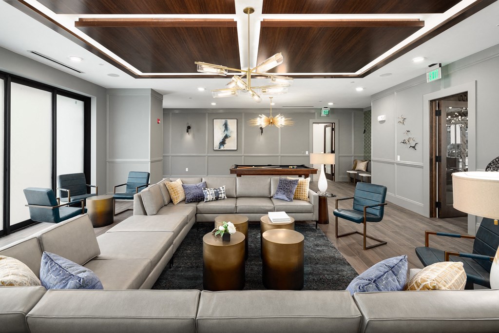 a large living room with couches and tables