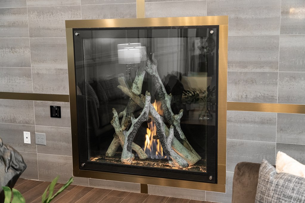 a roaring fire in a fireplace in a living room