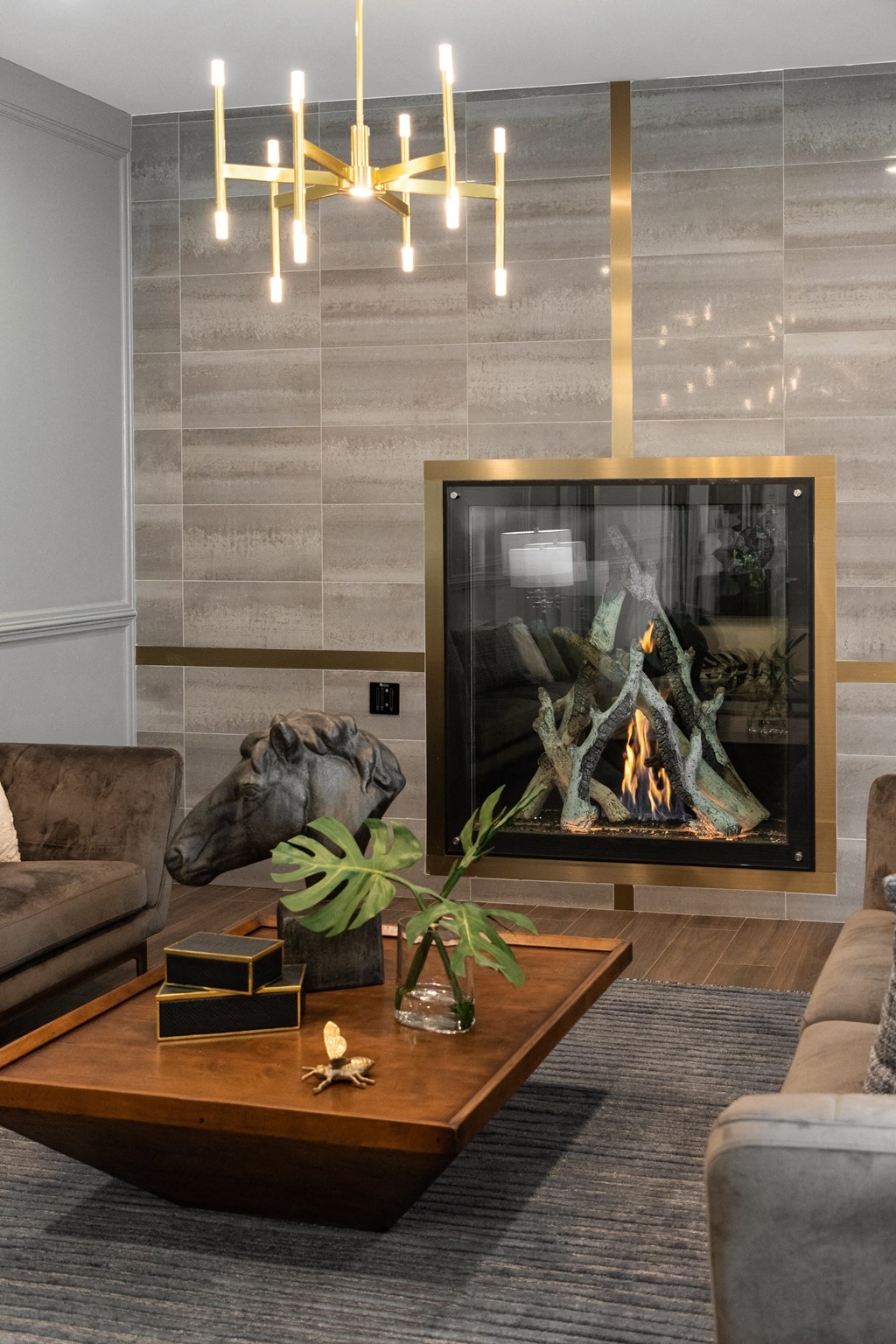 a living room with a fireplace and a coffee table