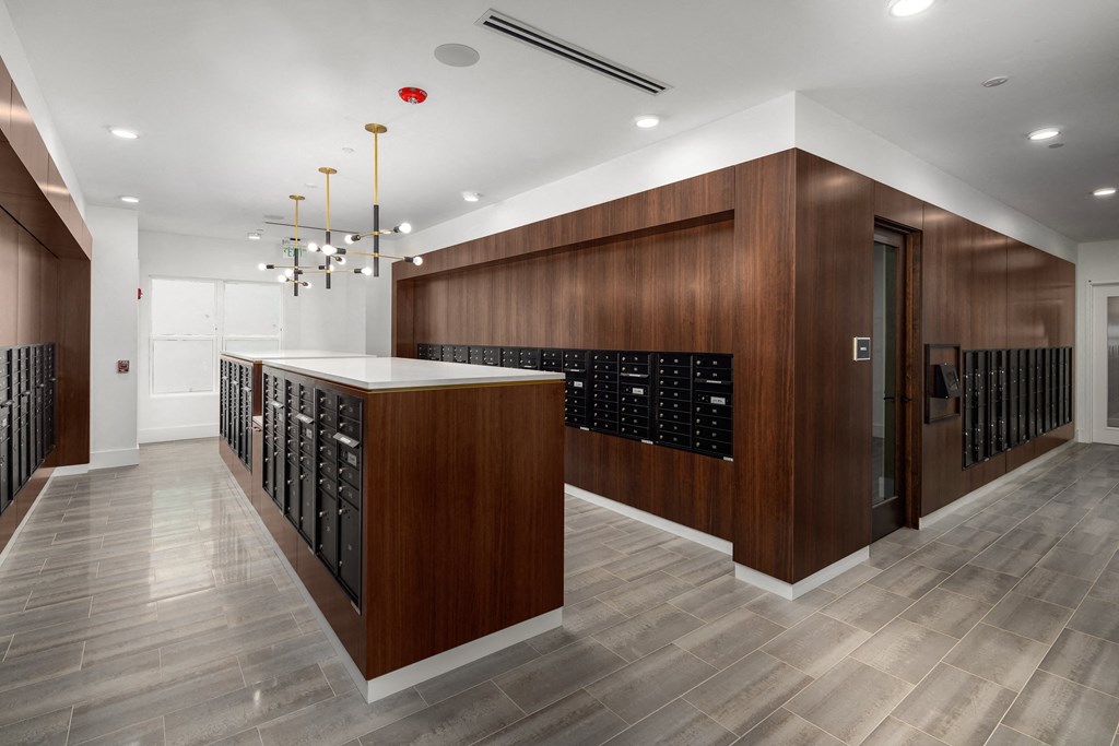 a tasting room with a counter and woodenework and a row of wine racks