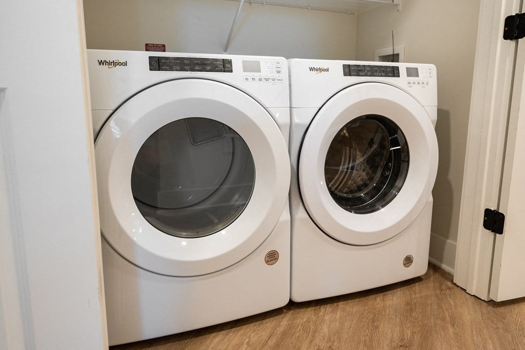 two washers and dryers in a laundry room