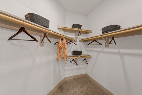 a room with chairs and shelves on the wall