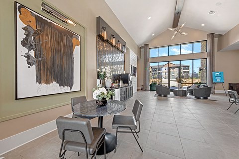 a dining room with a table and chairs