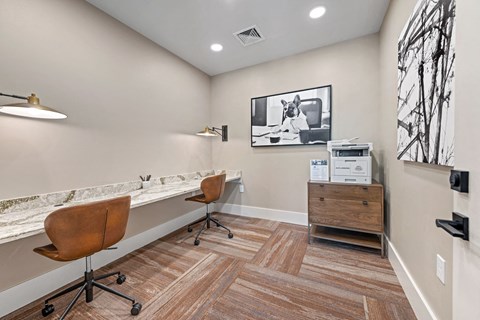 a home office with a desk and a chair