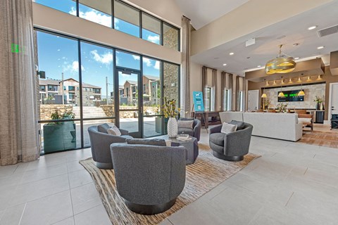 the lobby or reception area of a house with large windows