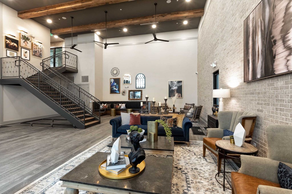 a living room with furniture and a staircase