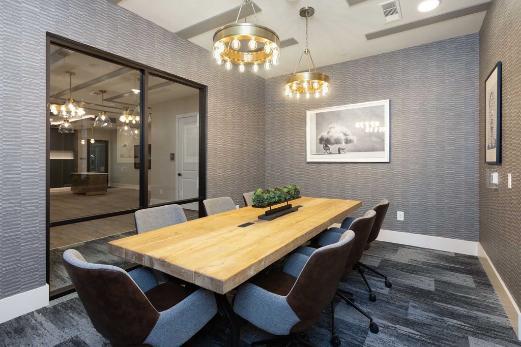 a conference room with a wooden table and chairs