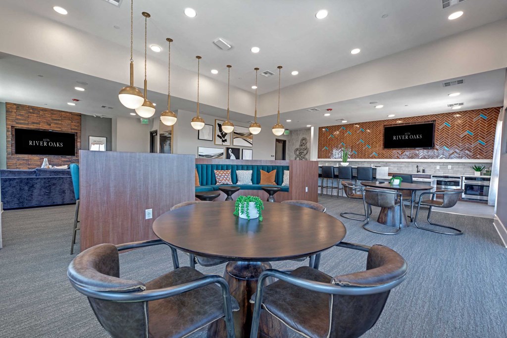 a dining room with a table and chairs