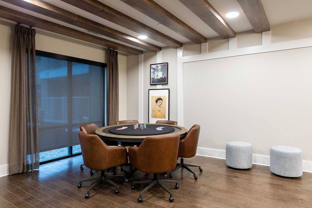 a conference room with a poker table and chairs