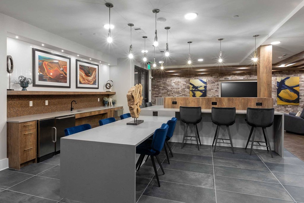 a dining room with a long table and chairs