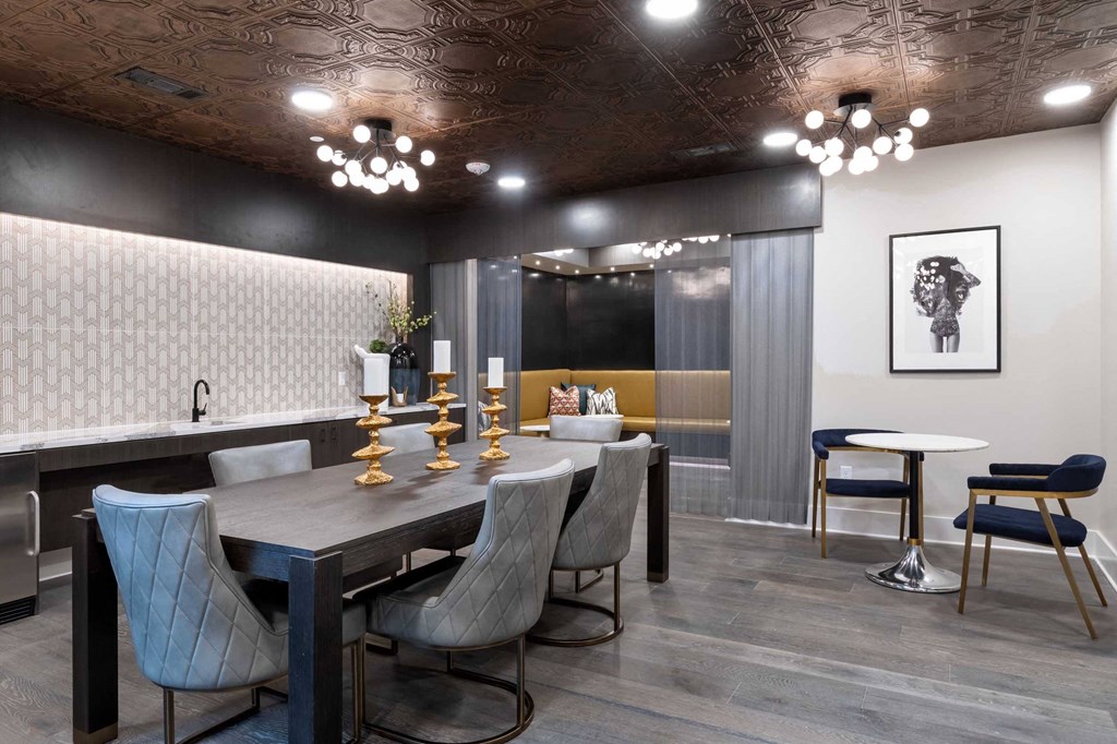 a dining room with a long table and chairs