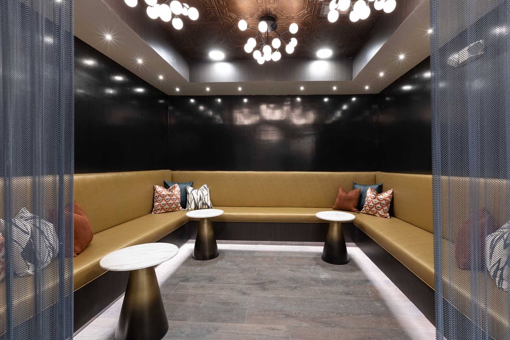 a living room with couches and tables