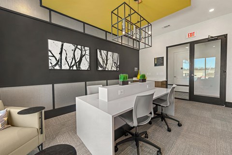 a conference room with a white desk and chairs