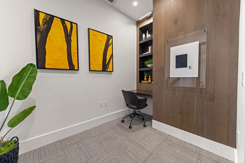 a room with a chair and a pattern on the wall