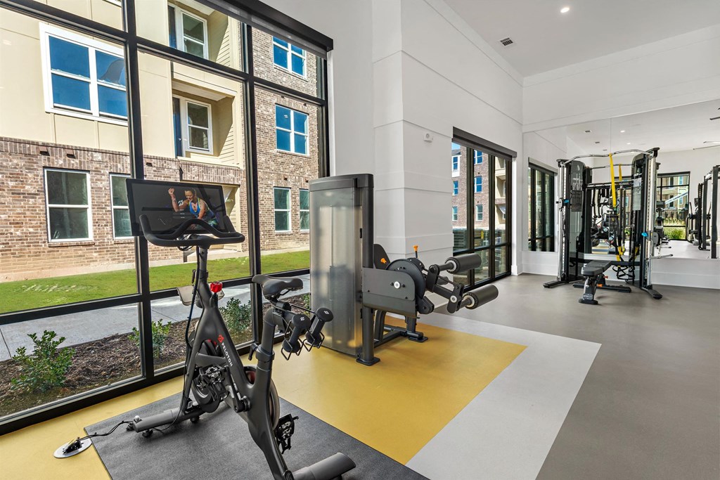 the residence apartments fitness room with exercise equipment