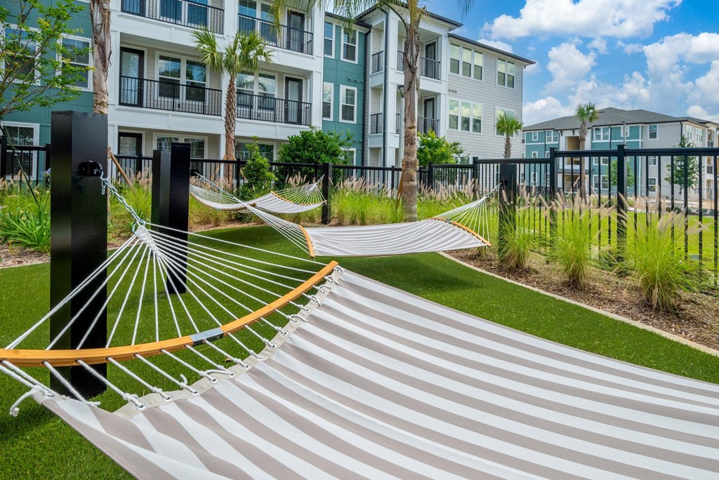 a conceptual image of a hammock under trees