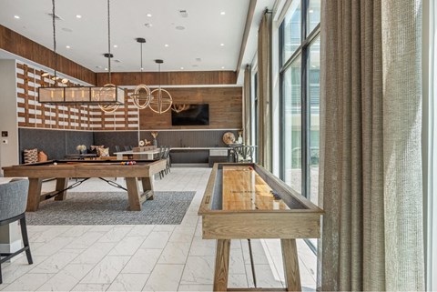 a game room with a ping pong table and a pool table