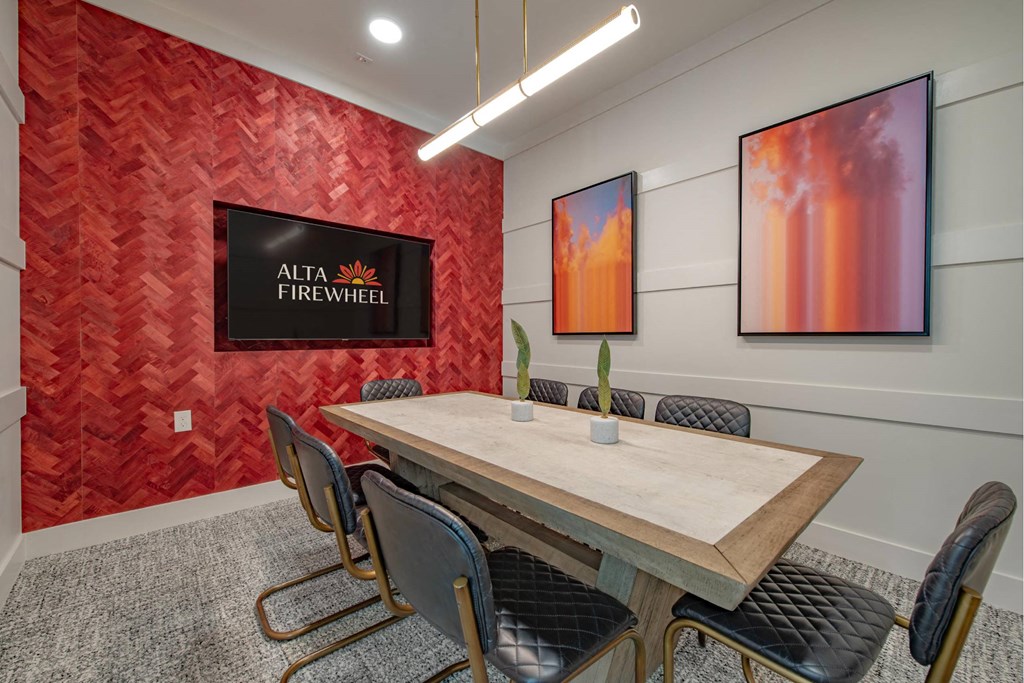 a conference room with a table and chairs