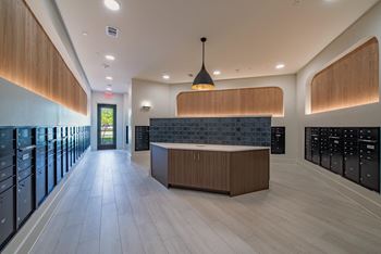 the tasting room has a large counter and a row of wine racks