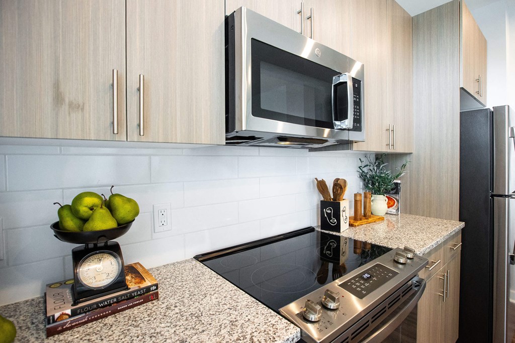 a kitchen with a stove and a microwave