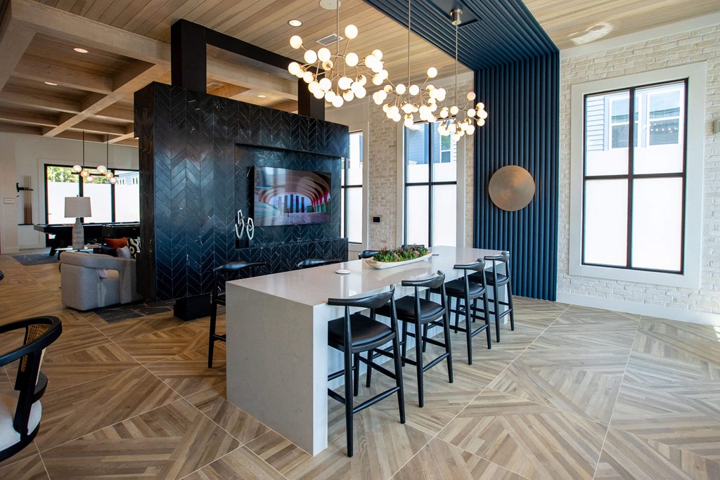 a dining room with a long table and chairs in a lobby