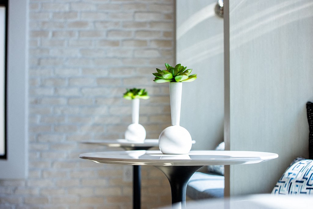 a small table with a vase on top of it