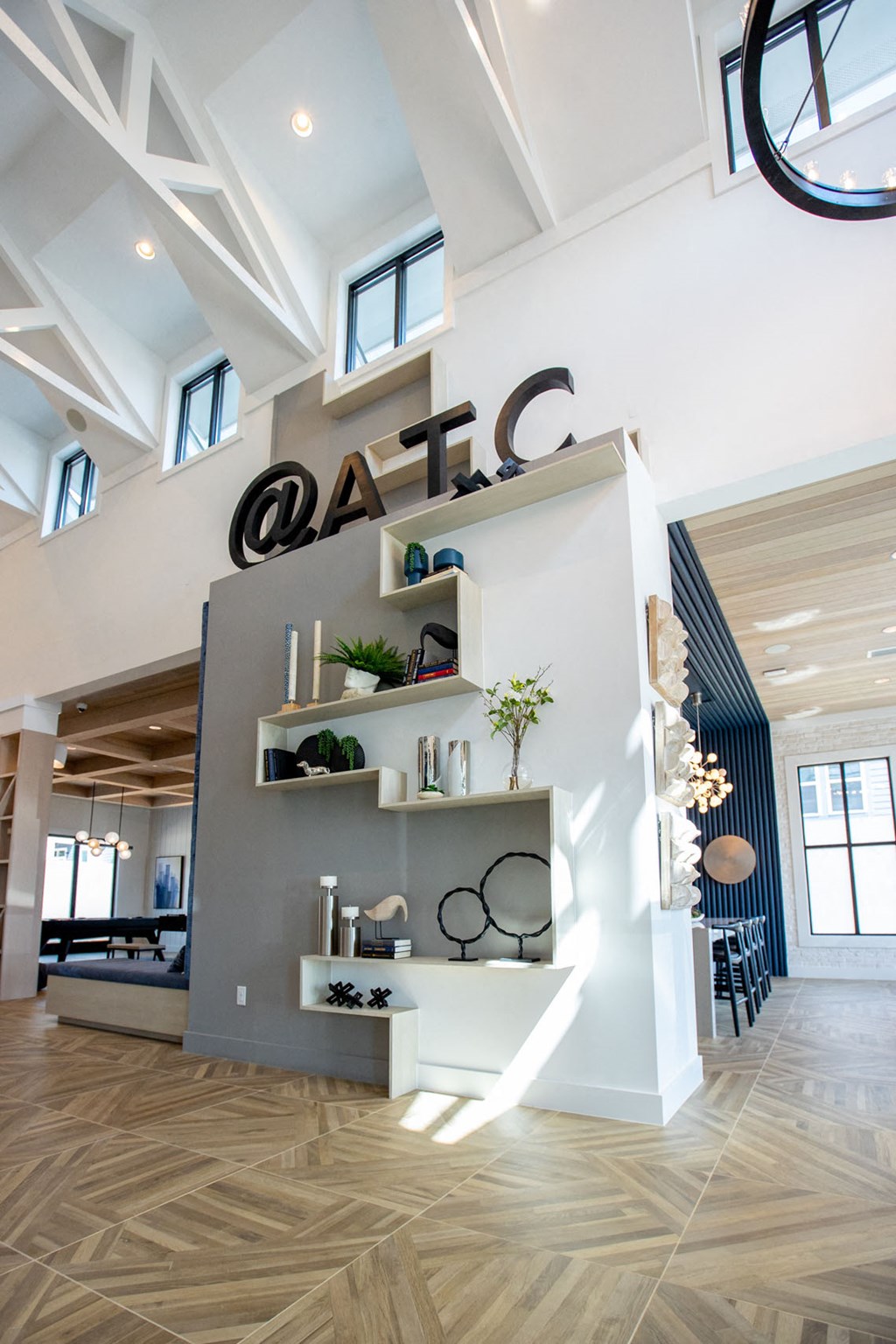 a view from the top of a staircase looking down into a building with a sign