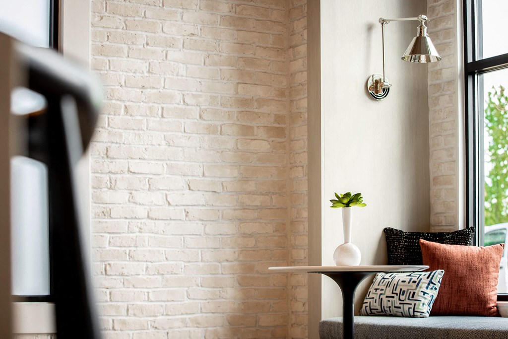 a living room with a couch and a table and a window