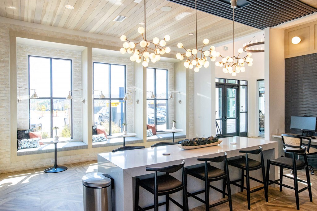 a large dining room with a large table and chairs