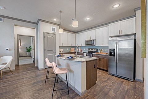 a kitchen with stainless steel appliances and a counter top