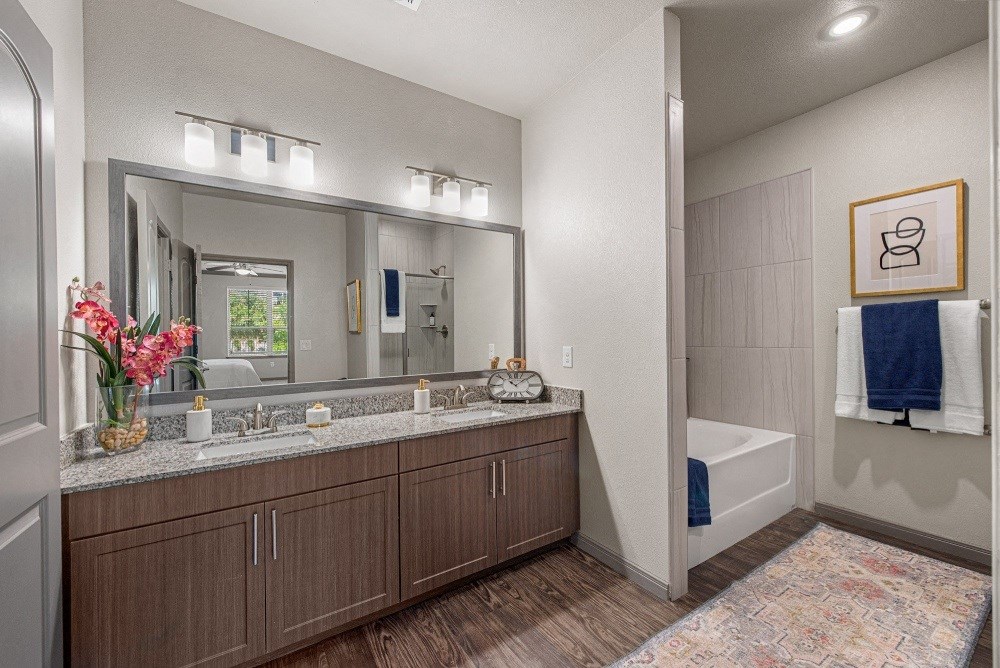 the retreat at thousand oaks spacious bathroom with granite counter tops and large mirror