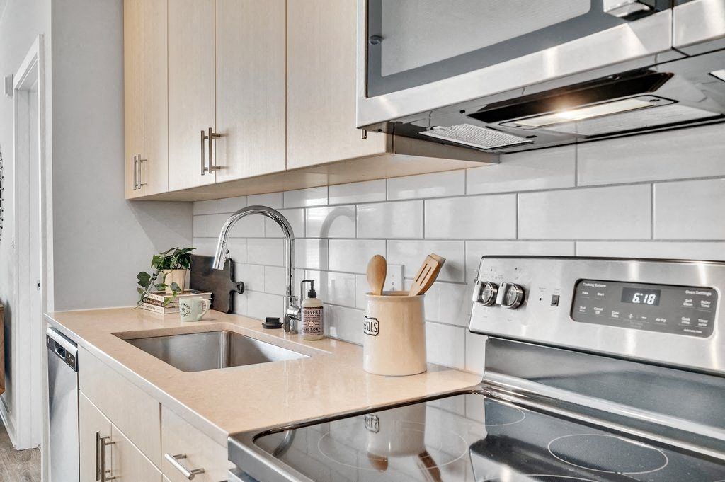 a kitchen with a sink and a stove