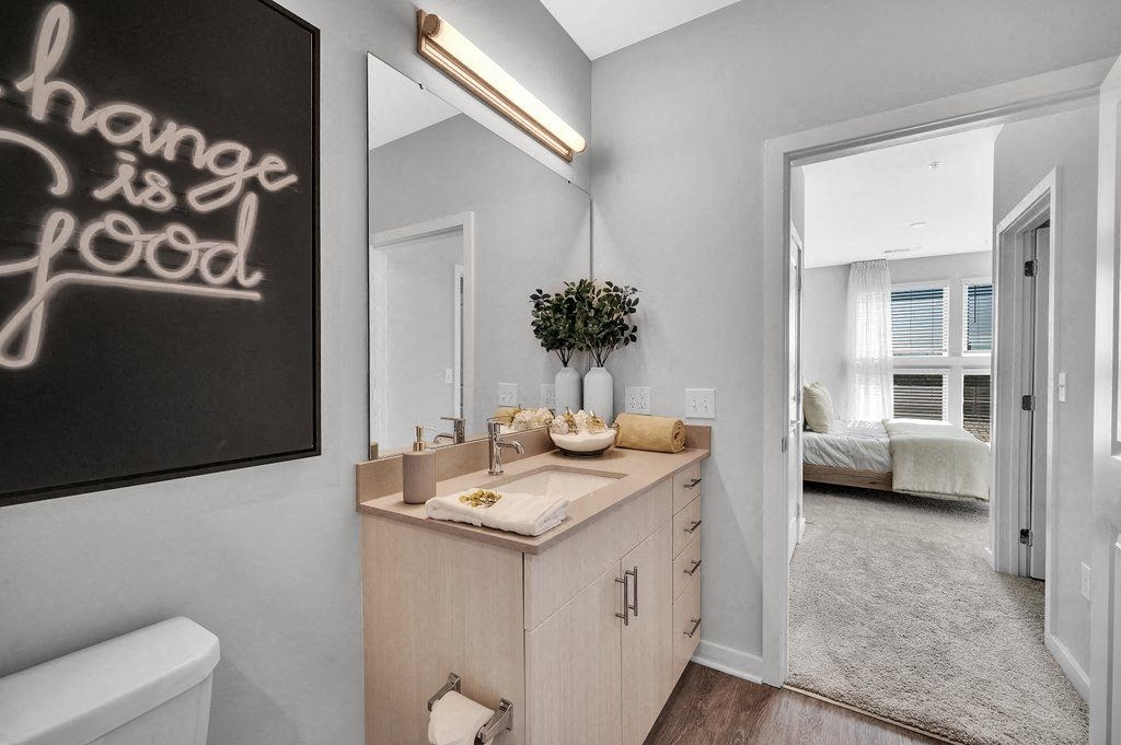 a small bathroom with a sink and a mirror