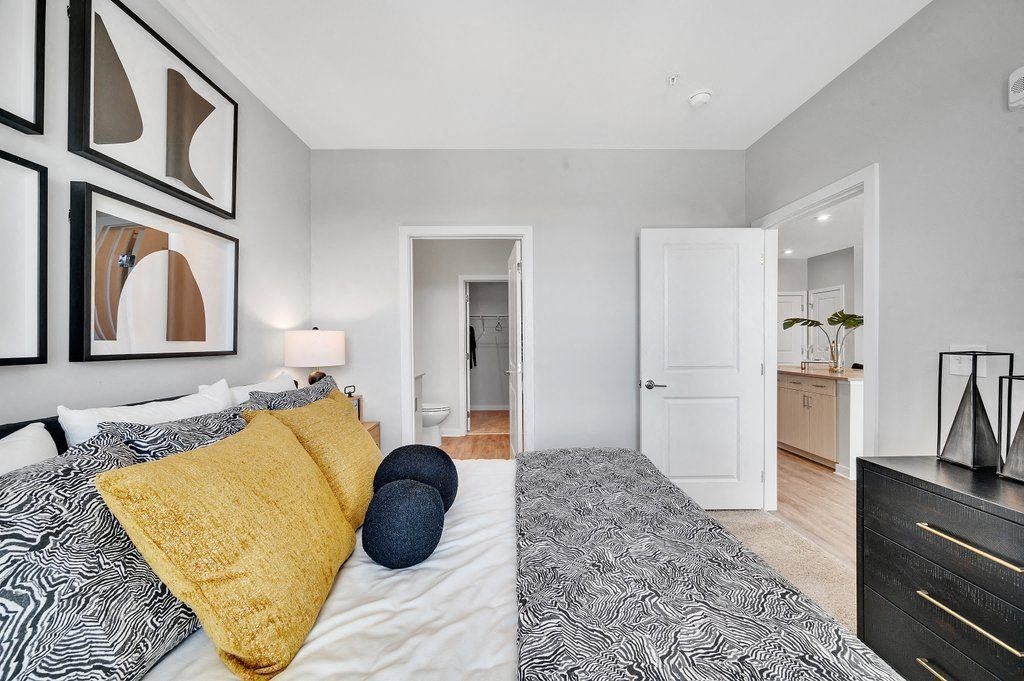 a bedroom with a bed and a closet