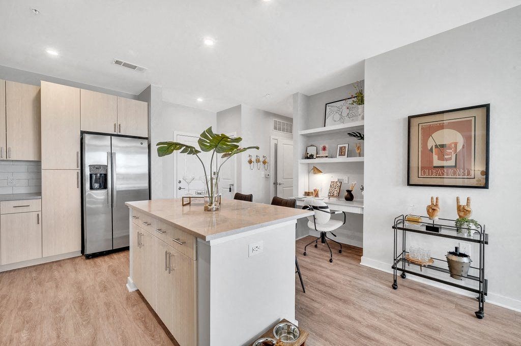 a kitchen with a large island in the middle