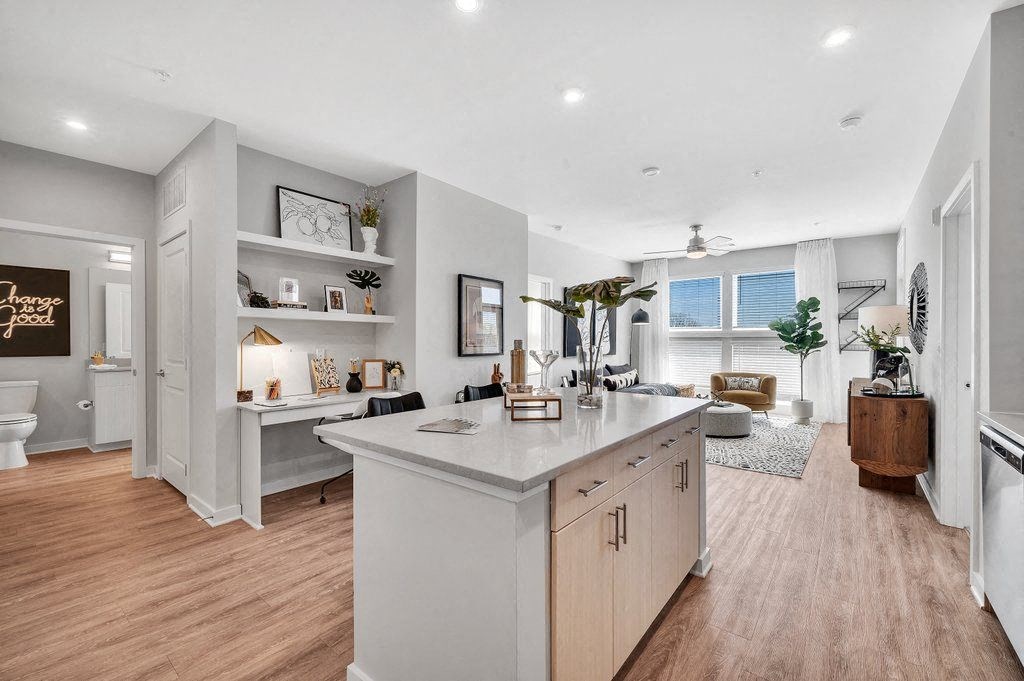 the kitchen is open to the living room and dining room