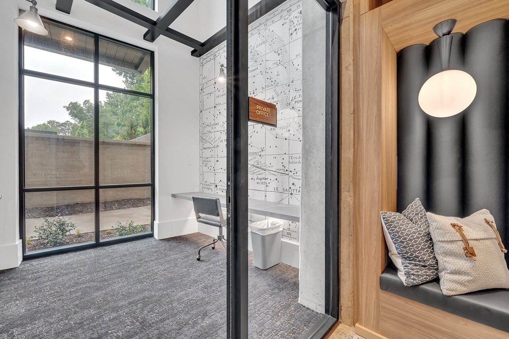 a bathroom with a shower and a toilet and a window
