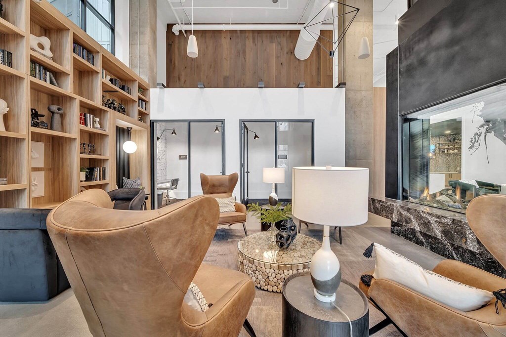 a living room filled with furniture and a fireplace